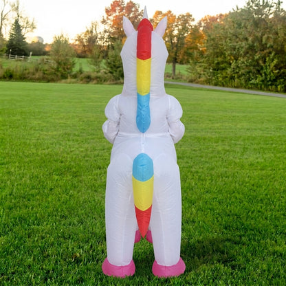 Back view of white unicorn costume showing the rainbow mane down the neck and rainbow tail