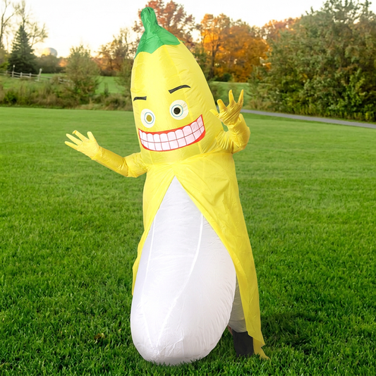 Three quarter view of inflatable banana costume waving, grinning cartoon face and peeled yellow skin