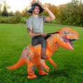 Three quarter view of inflatable ride on T-Rex costume with orange striped body and open toothy jaw