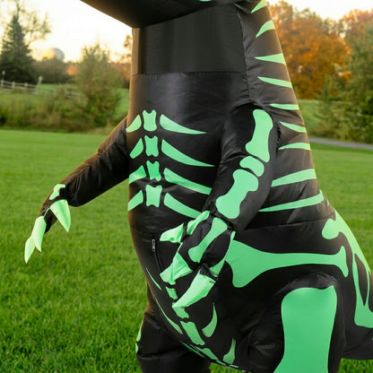 Close up of skeleton dinosaur costume torso showing green rib cage, arm bones and small claws