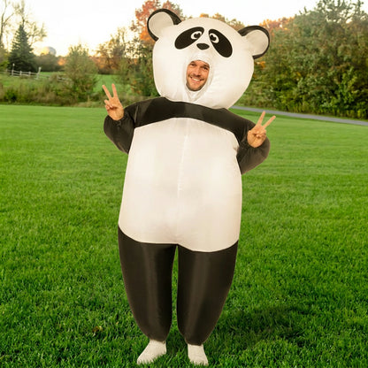 Front view of giant inflatable panda costume with face opening, adult giving peace signs in a park
