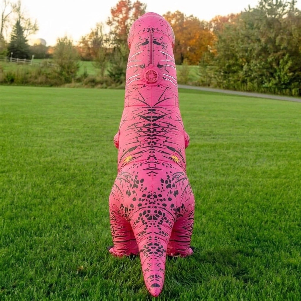 Back view of pink inflatable T-Rex costume showing the tail and spotted pattern on the legs