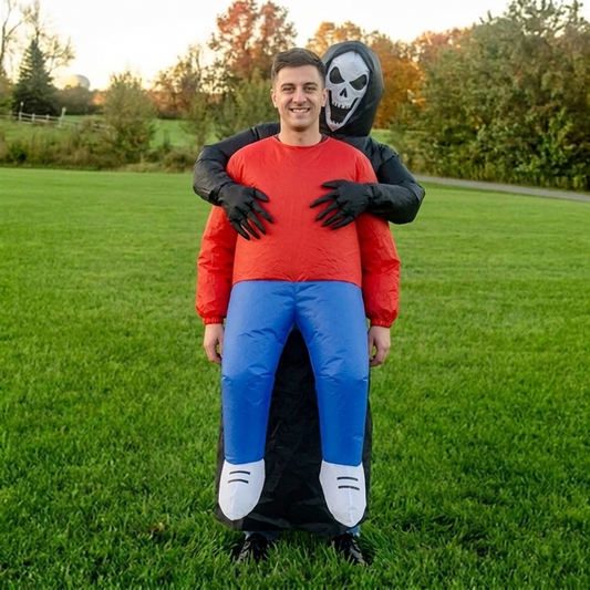 Front view of inflatable grim reaper carrying human costume with skull face and black gloved hands